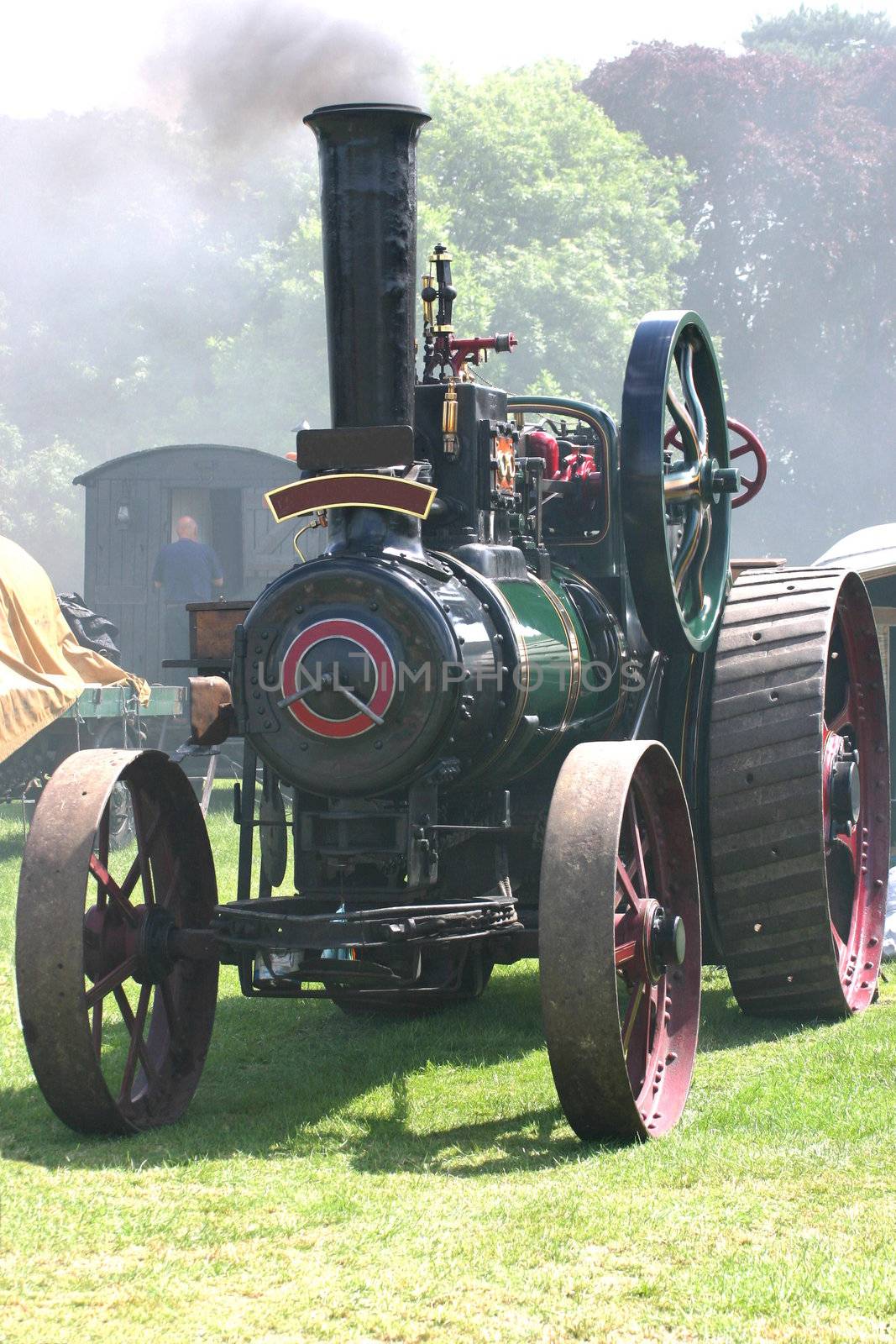 green traction stream engine at a steam rally