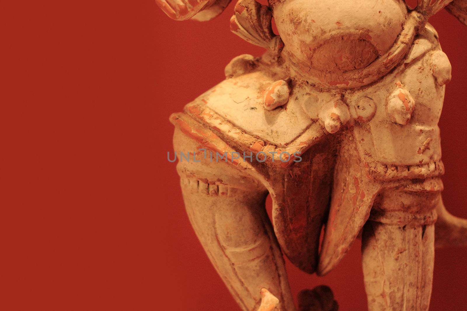 close up of buddha leg over red background