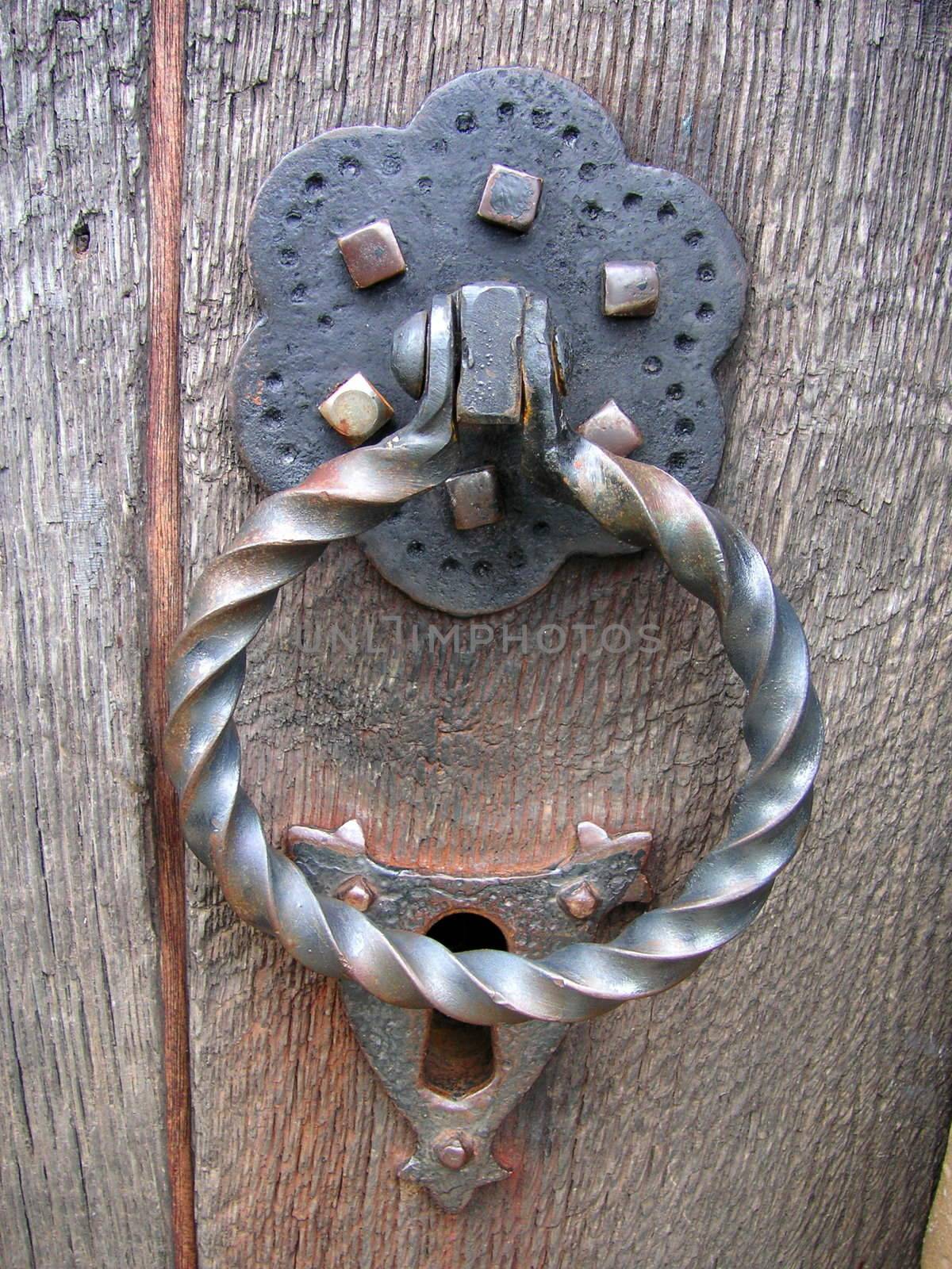 old medieval iron handle and lock of a church door