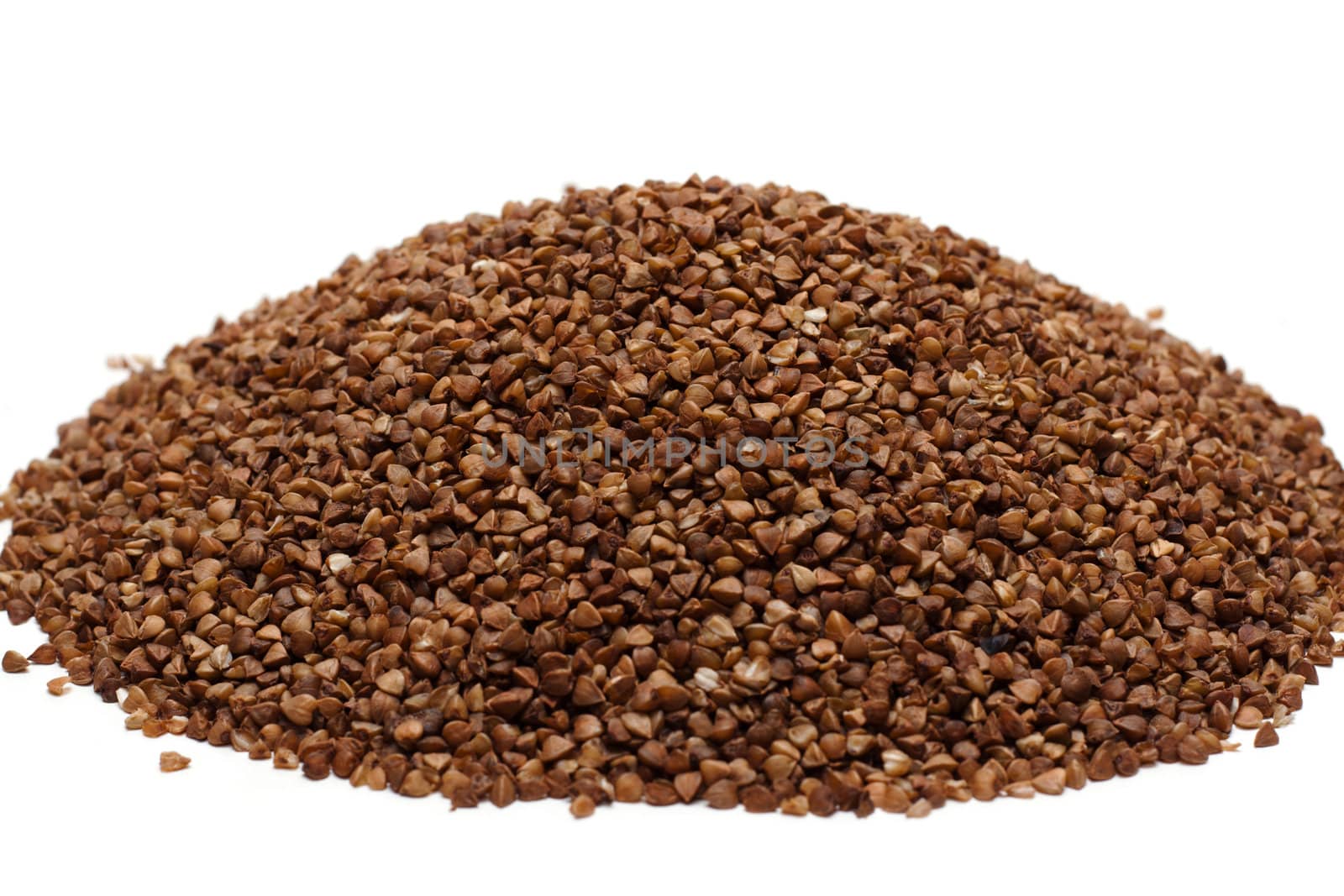 Heap buckwheat croups, disposit on white background
