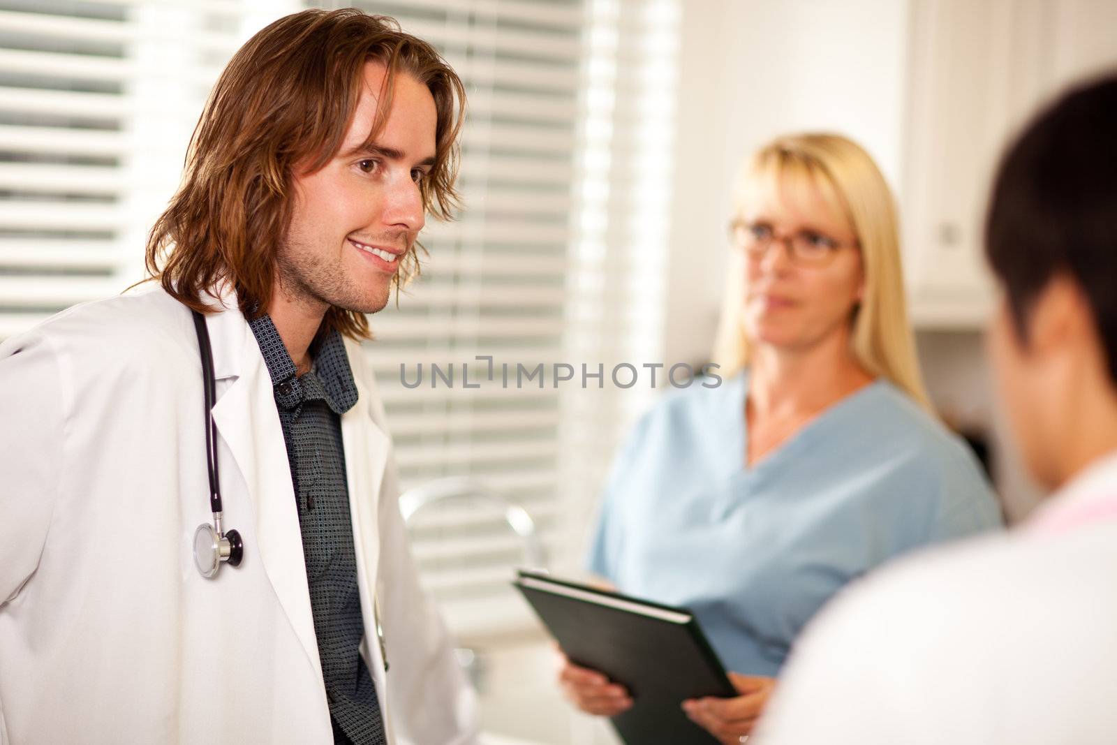 Doctors and Nurses Having A Casual Conversation in The Office.