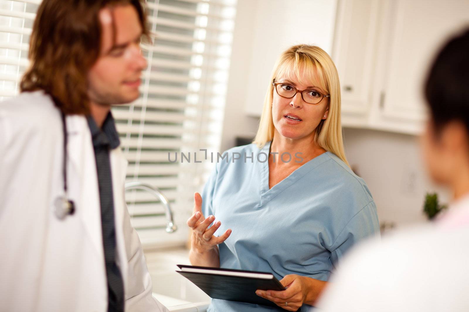 Doctors and Nurses Having A Casual Conversation in The Office.