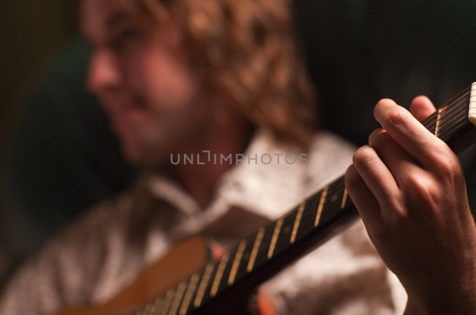 Young Musician Plays His Acoustic Guitar by Feverpitched