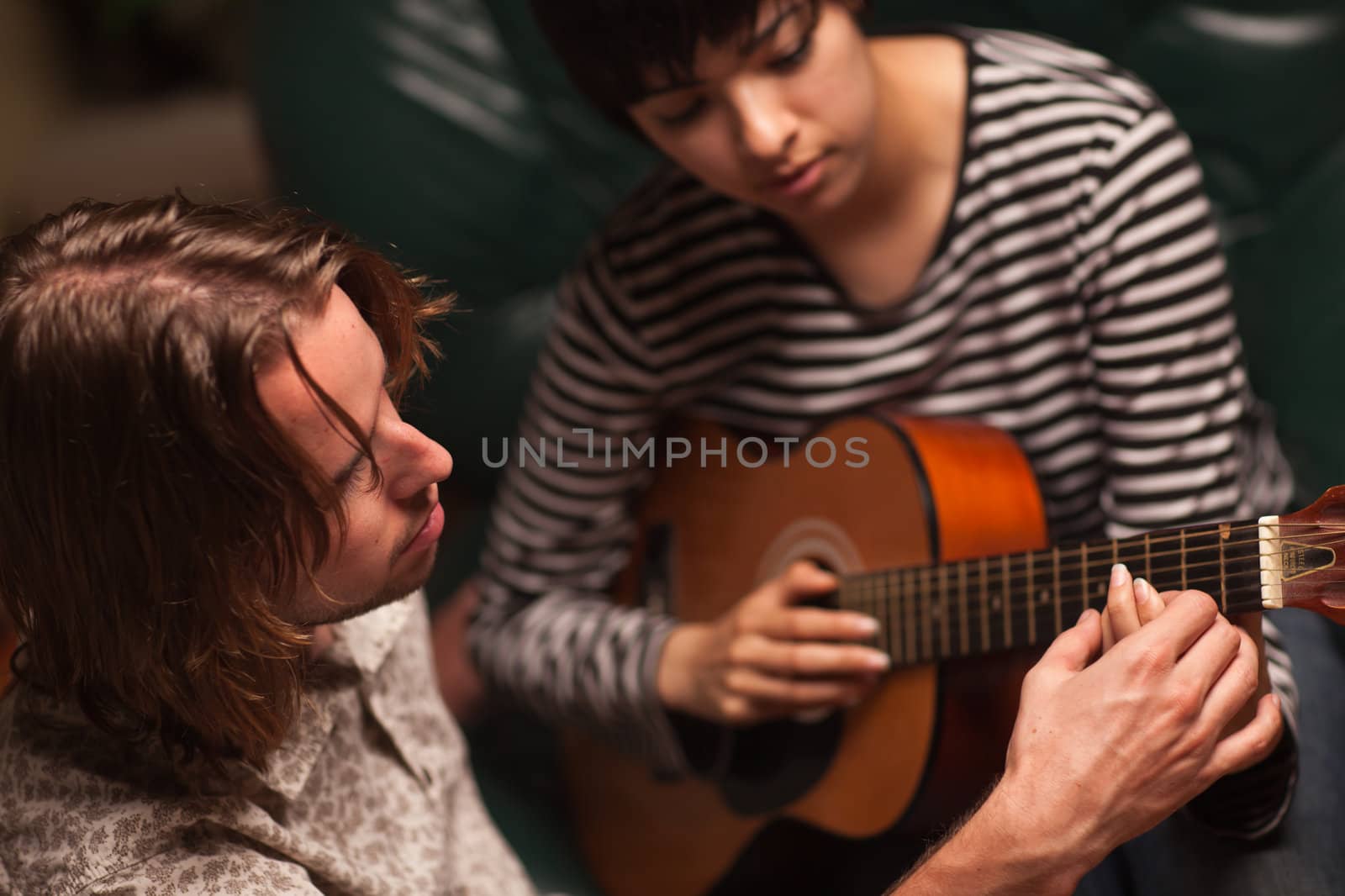 Young Musician Teaches Female Student To Play the Guitar by Feverpitched