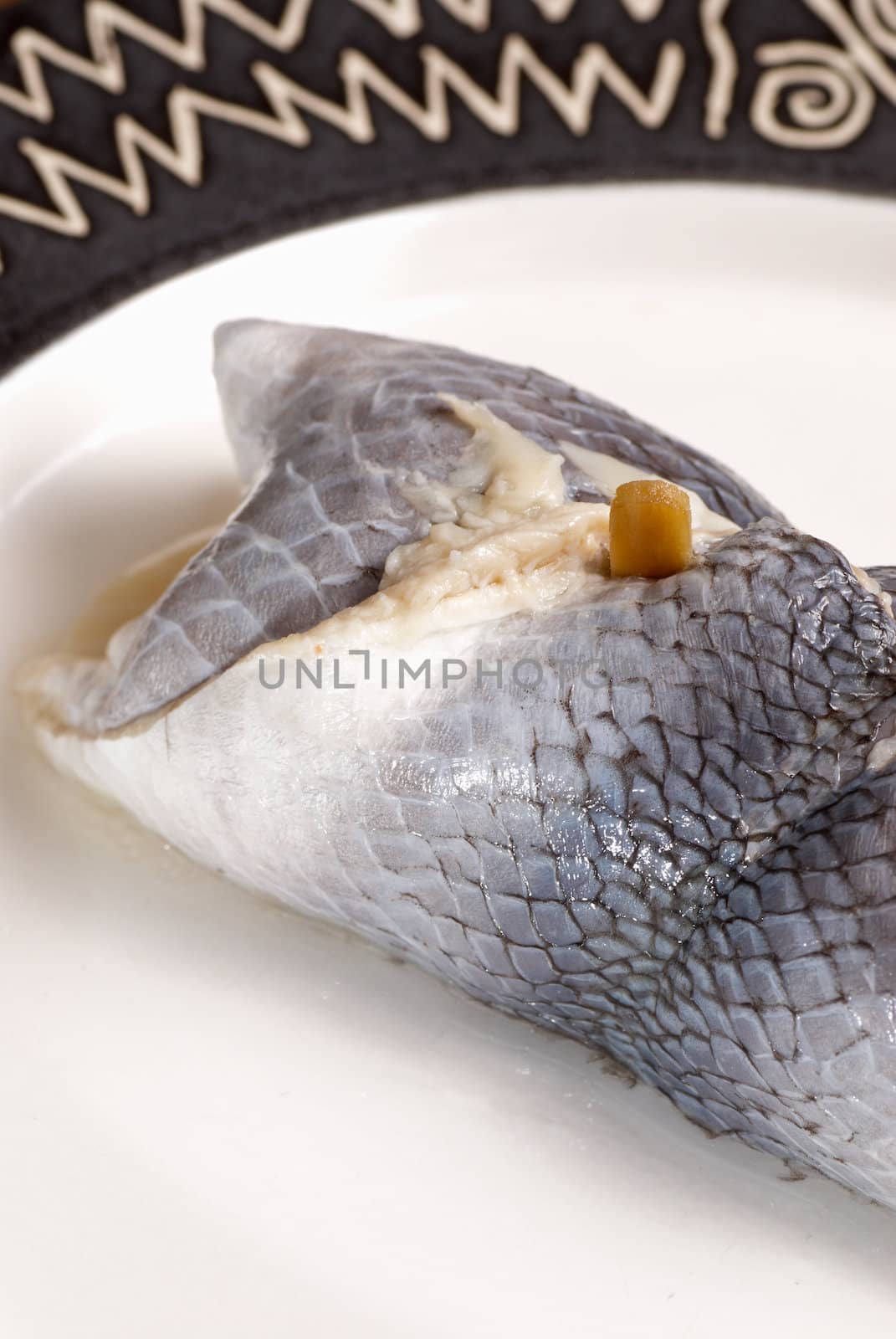 Closeup take of  a pickled rollmops herring