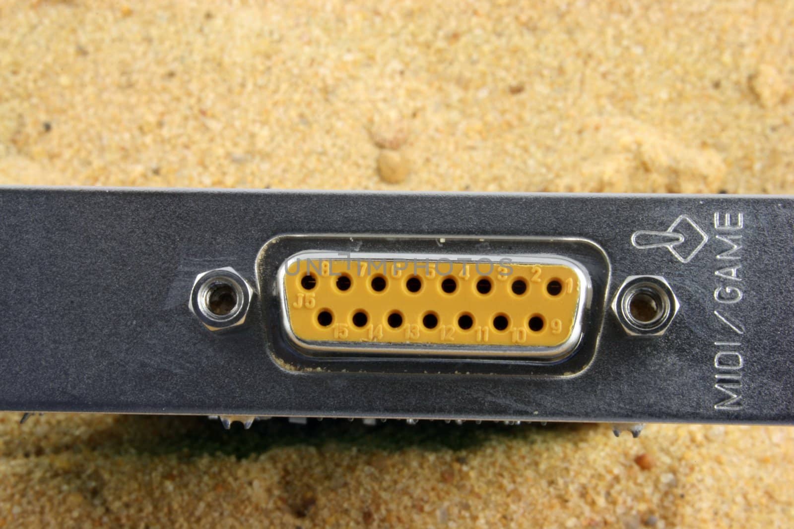 Game connection port rising out of the sand
