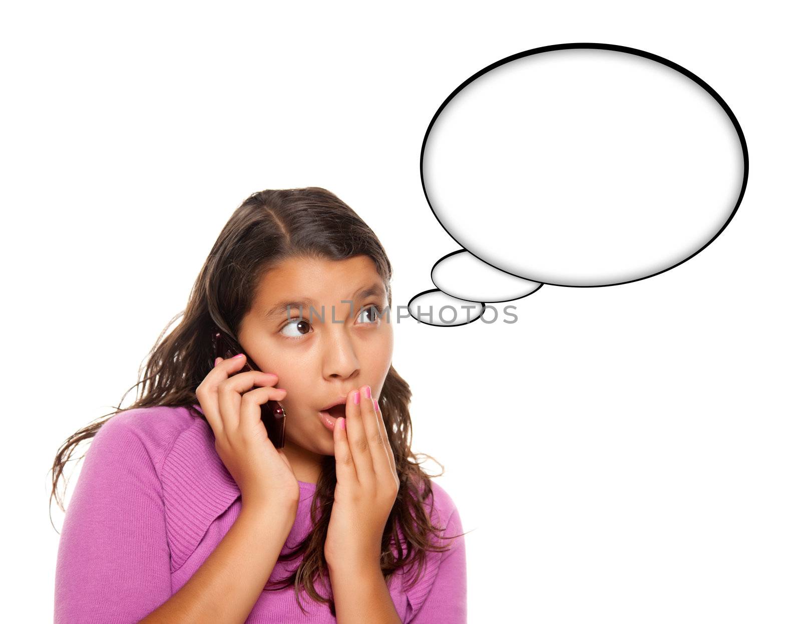 Shocked Hispanic Teen Aged Girl on Cell Phone with Blank Thought Bubble Isolated on a White Background - Contains Clipping Paths.