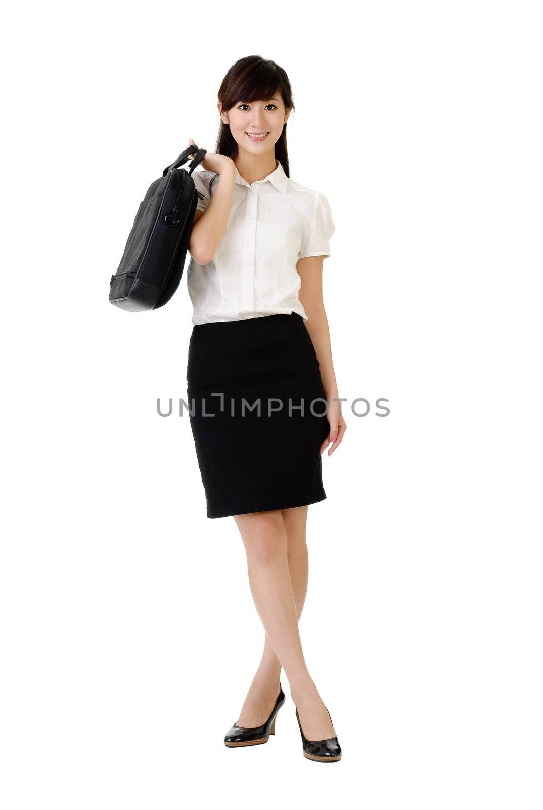 Business lady holding briefcase on shoulder, full length portrait isolated on white.