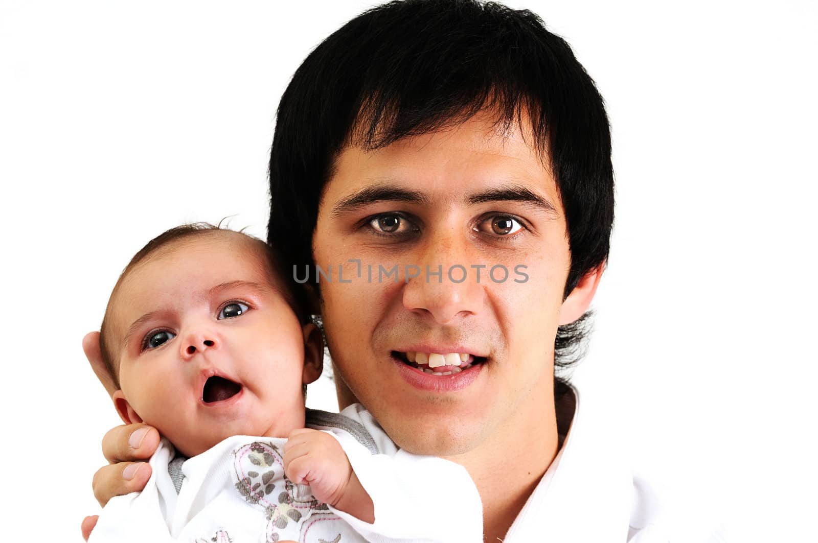 father holding a yawning newborn baby and smiling by Ansunette