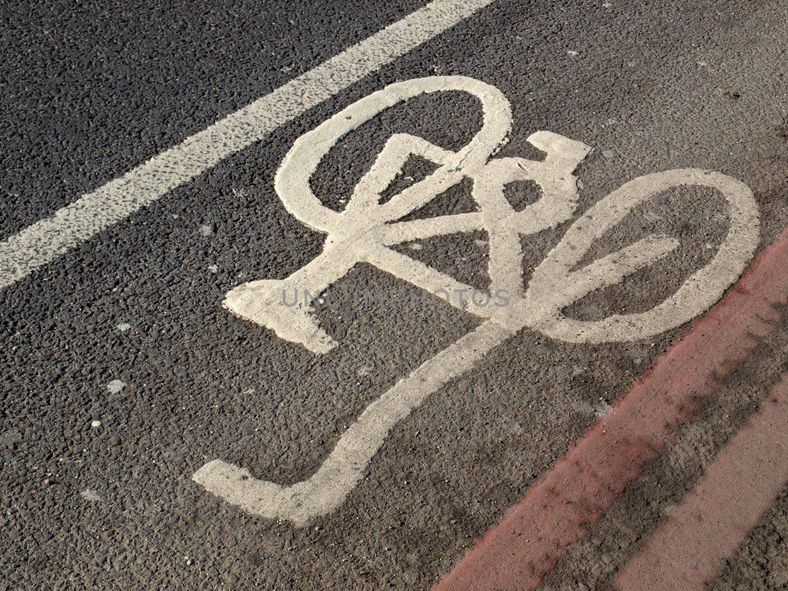 Bicycle lane sign painted on a street