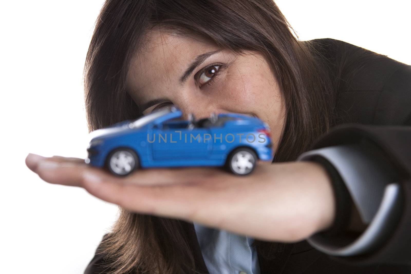 young businesswoman holding small car in the hand by mlopes