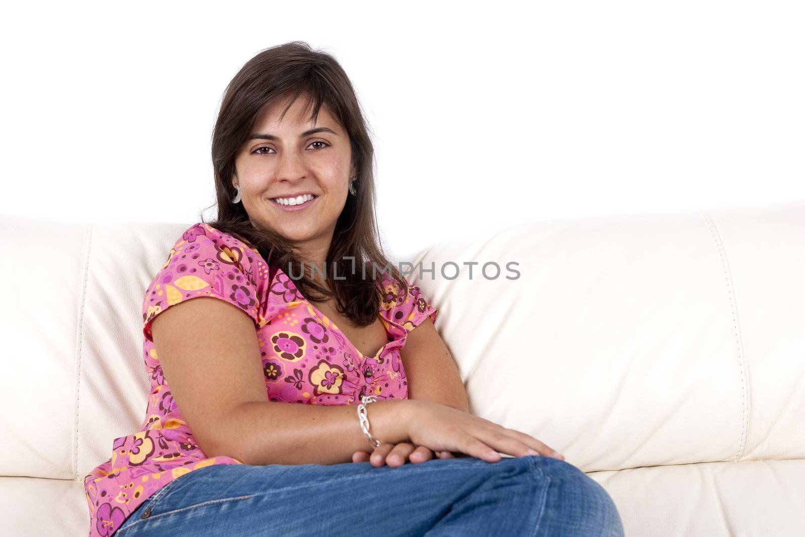 beautiful young woman relaxing in the couch - home and lifestyle concept