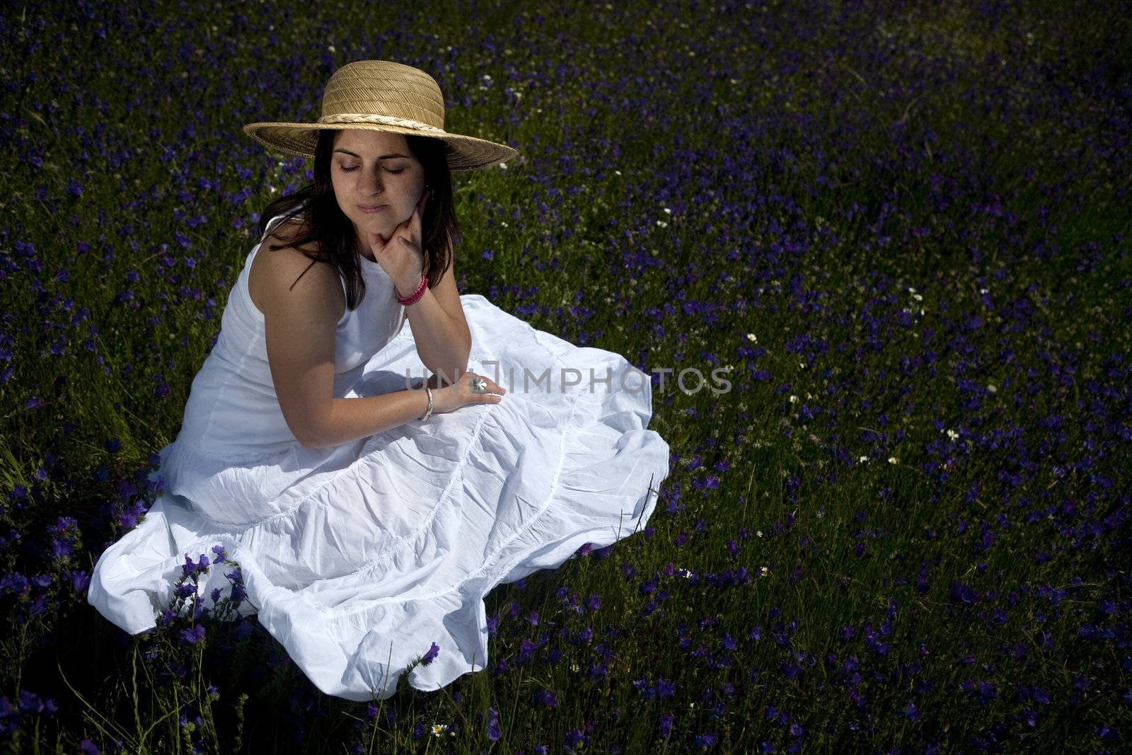 beautiful woman in white dress relaxing in the nature