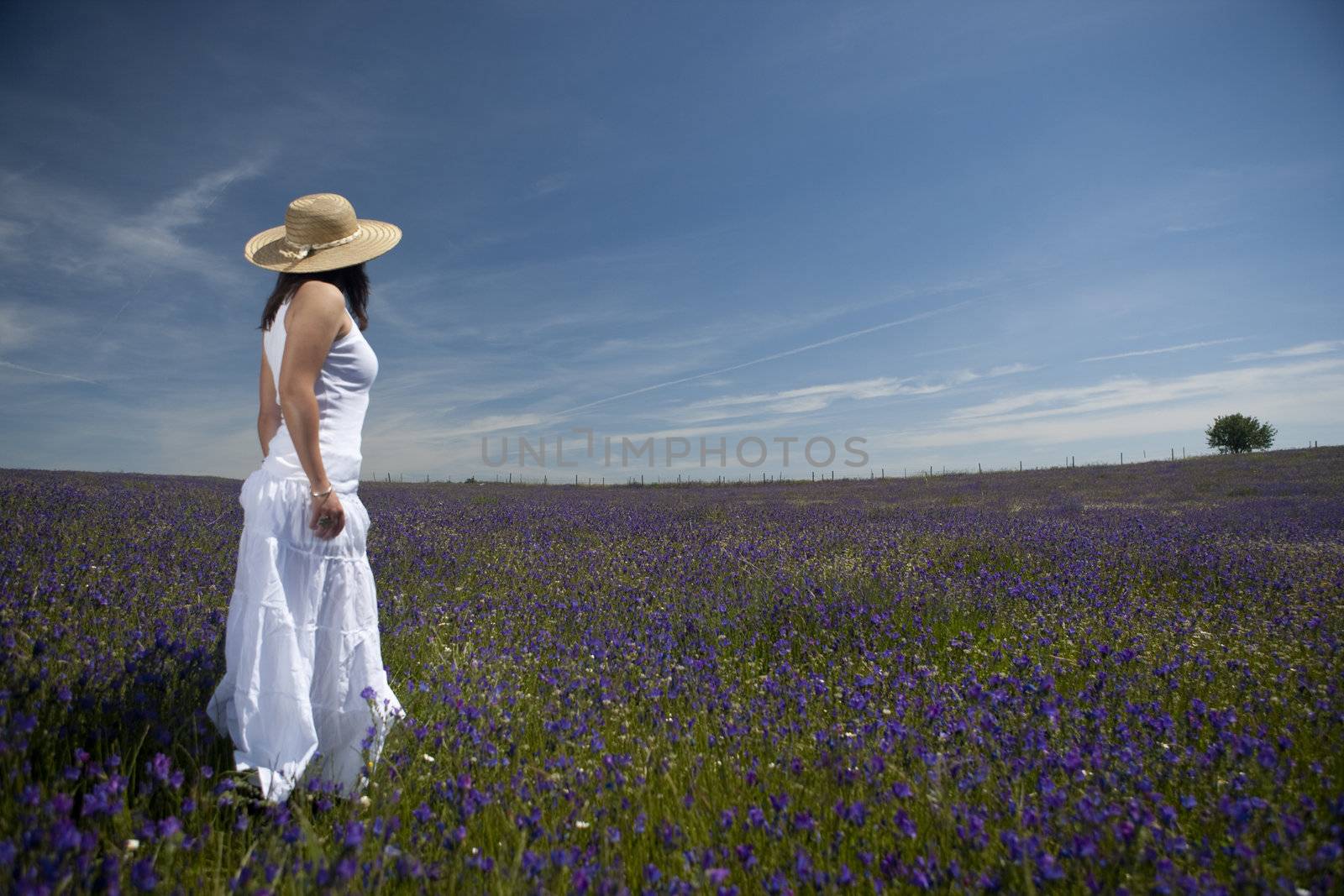 beautiful woman in white dress relaxing in the nature by mlopes