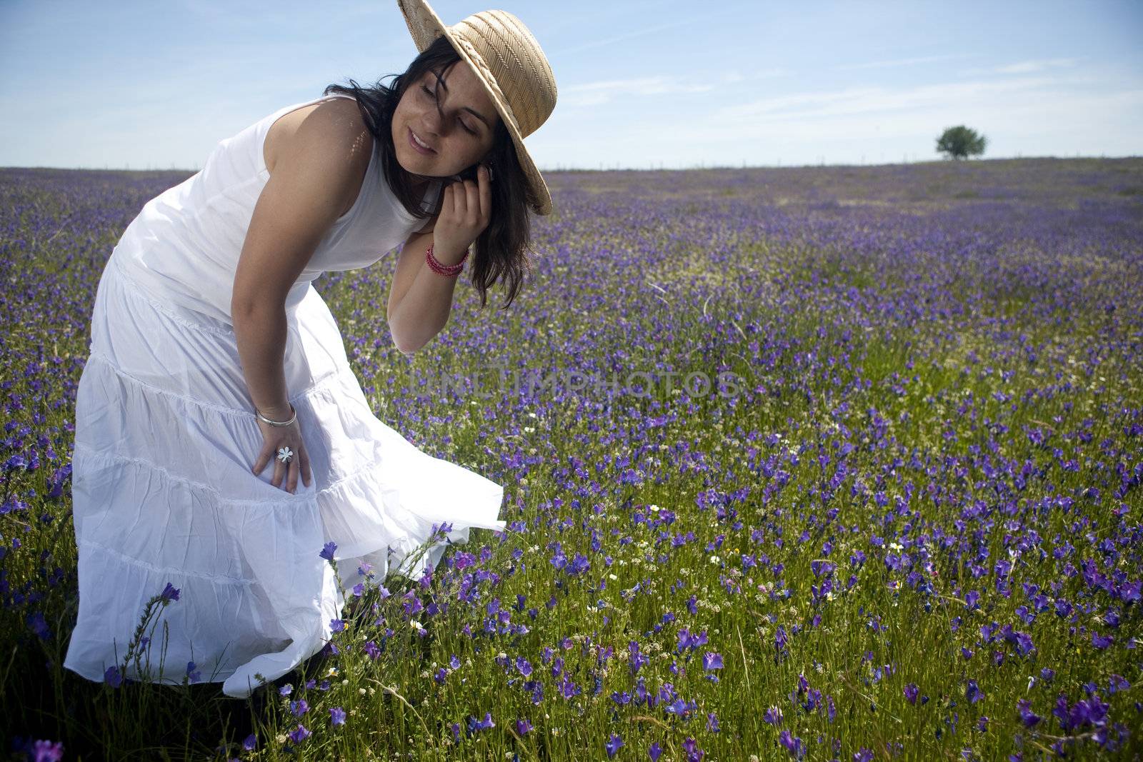 beautiful woman in white dress relaxing in the nature by mlopes