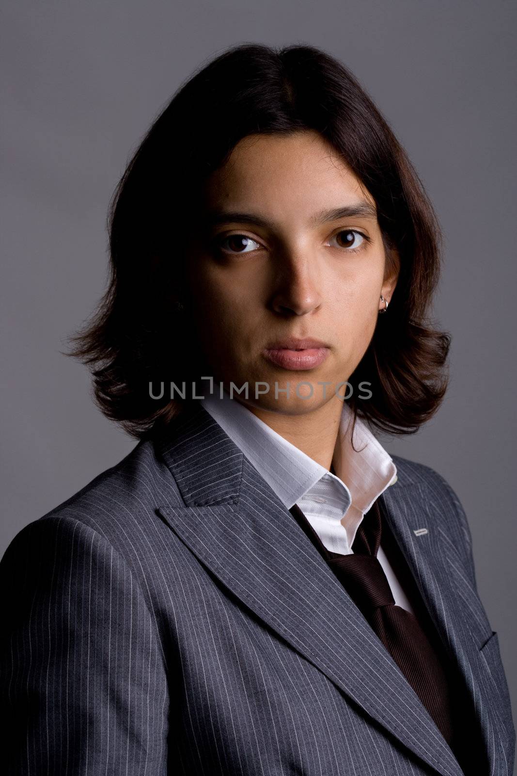 businesswoman headshot portrait. grey background.