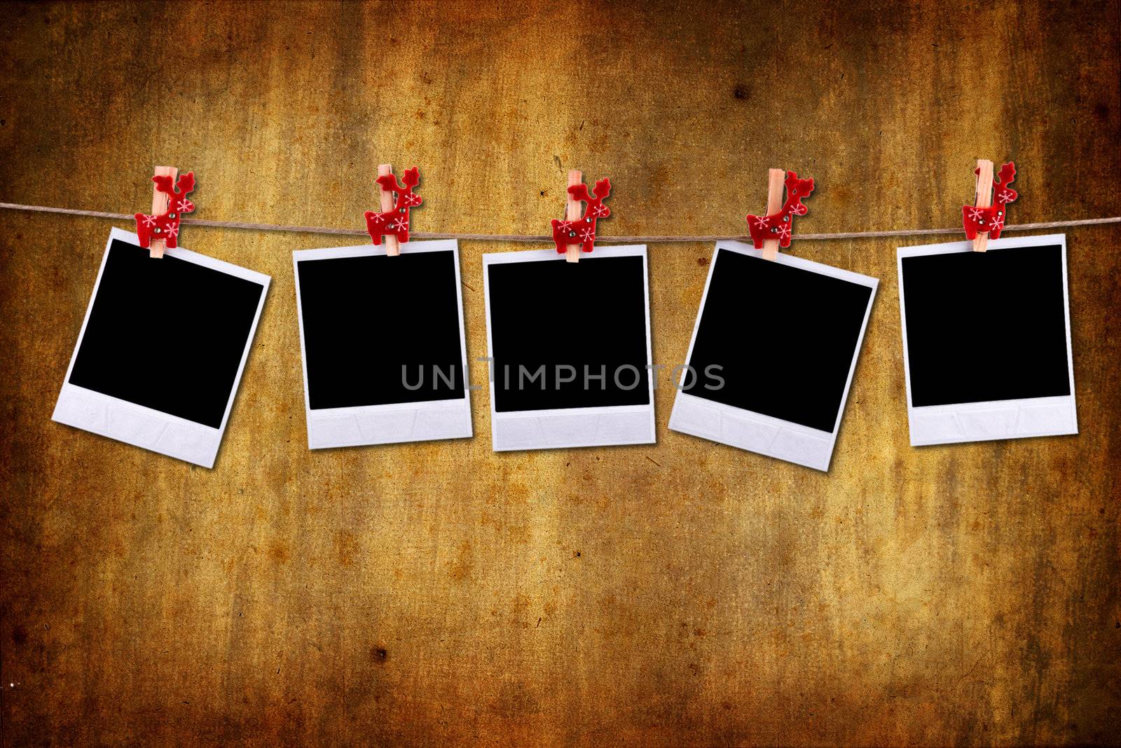 empty photo frames over grunge background by mlopes