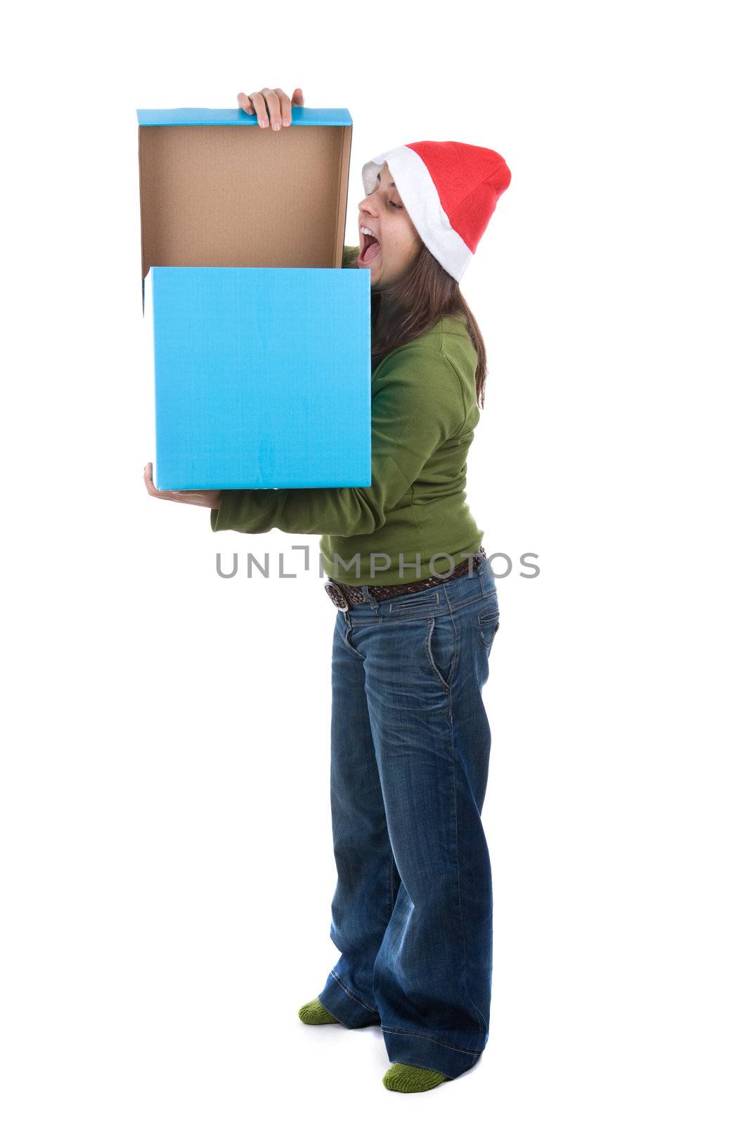 beautiful santa woman celebrating christmas with big blue present box. isolated on white background. portrait orientation.