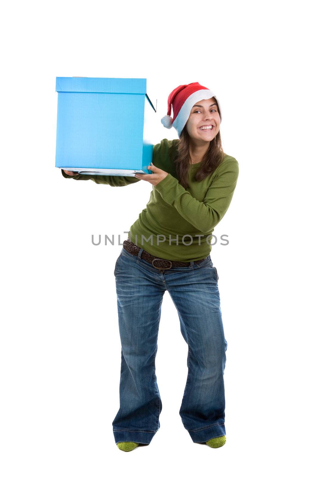 beautiful santa woman celebrating christmas holiday holding big blue present box. isolated on white background. portrait orientation.