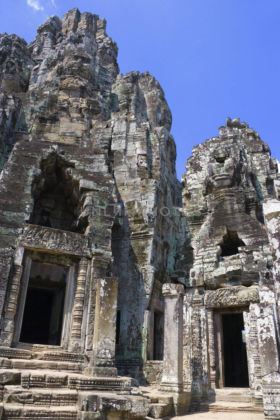 Image of UNESCO's World Heritage Site of Bayon, which is part of the larger temple complex of Angkor Thom, located at Siem Reap, Cambodia. This is one of the temples in Siem Reap where the Hollywood movie Lara Croft Tomb Raider was filmed at.