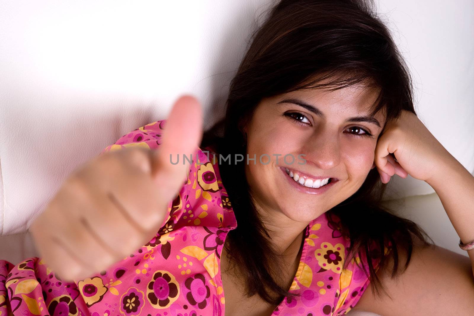 beautiful young woman smiling with thumbs up by mlopes