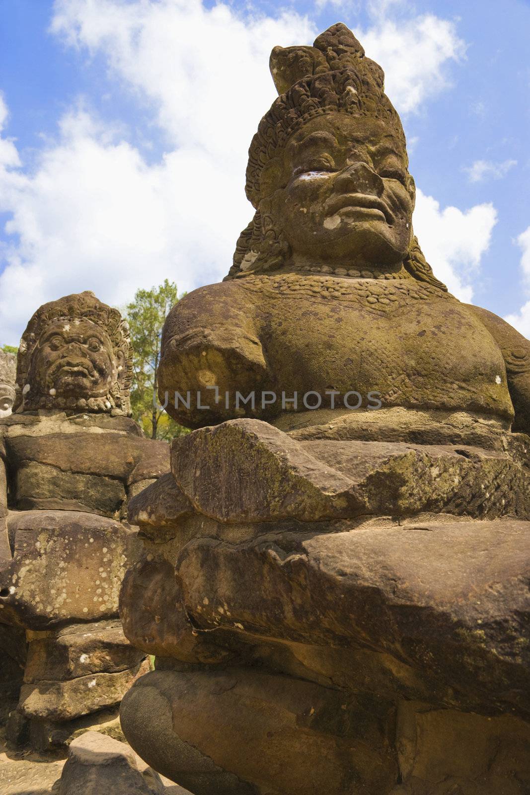 Image of ancient demon statues at the South Gate of UNESCO's World Heritage Site of Angkor Thom, Siem Reap, Cambodia. 