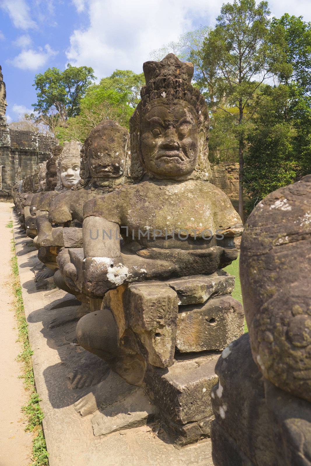 Image of ancient demon statues at the South Gate of UNESCO's World Heritage Site of Angkor Thom, Siem Reap, Cambodia. 