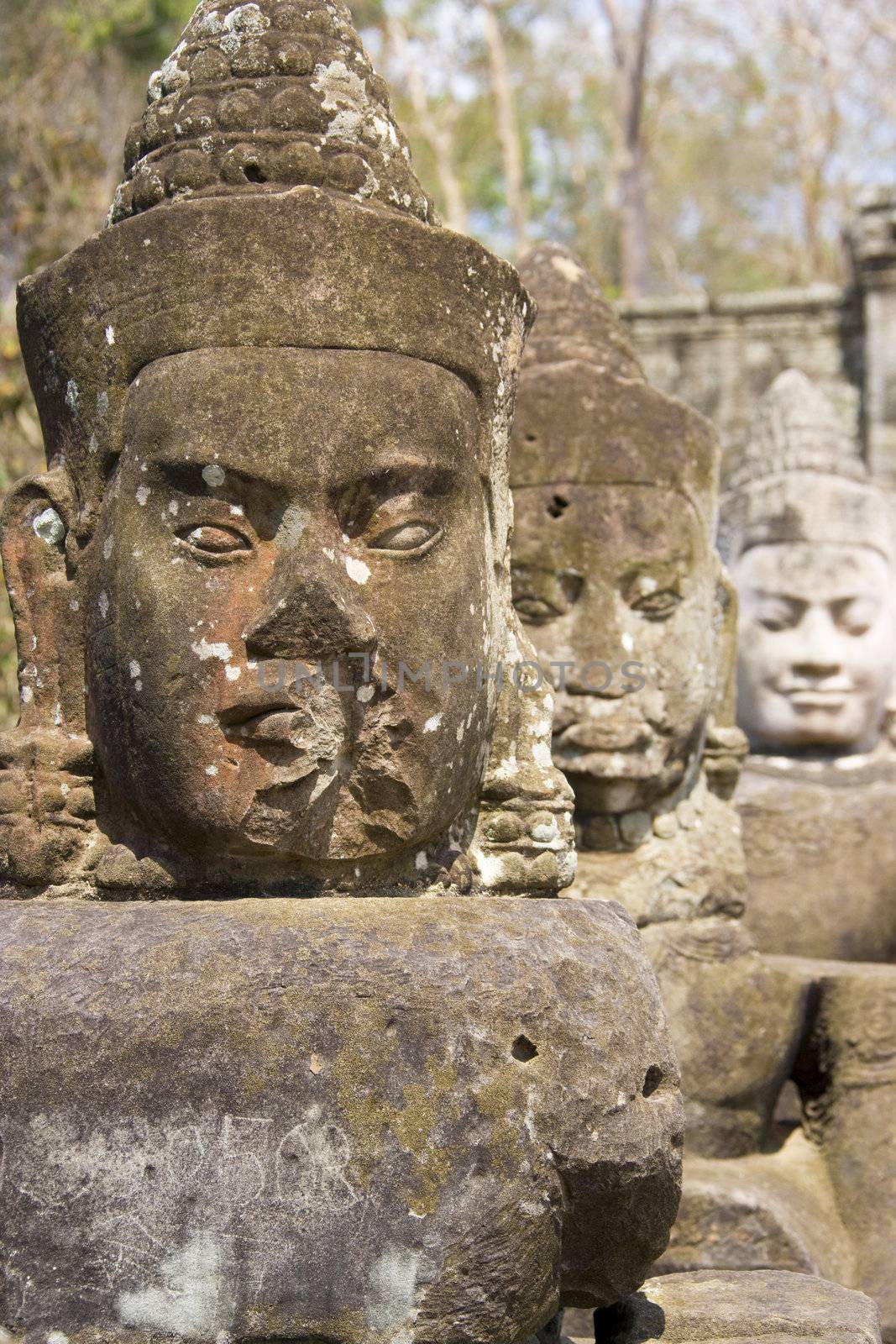 Image of ancient statues of gods at the South Gate of UNESCO's World Heritage Site of Angkor Thom, Siem Reap, Cambodia. 