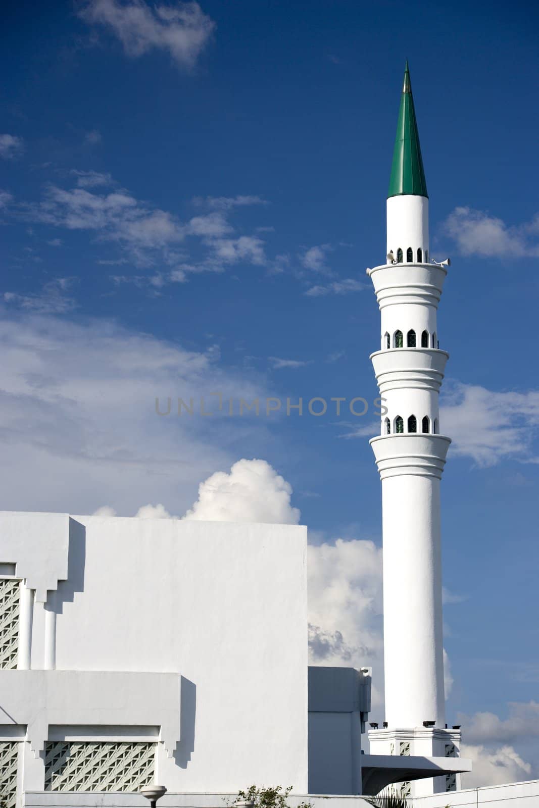 Image of a minaret of a modern mosque in Malaysia.