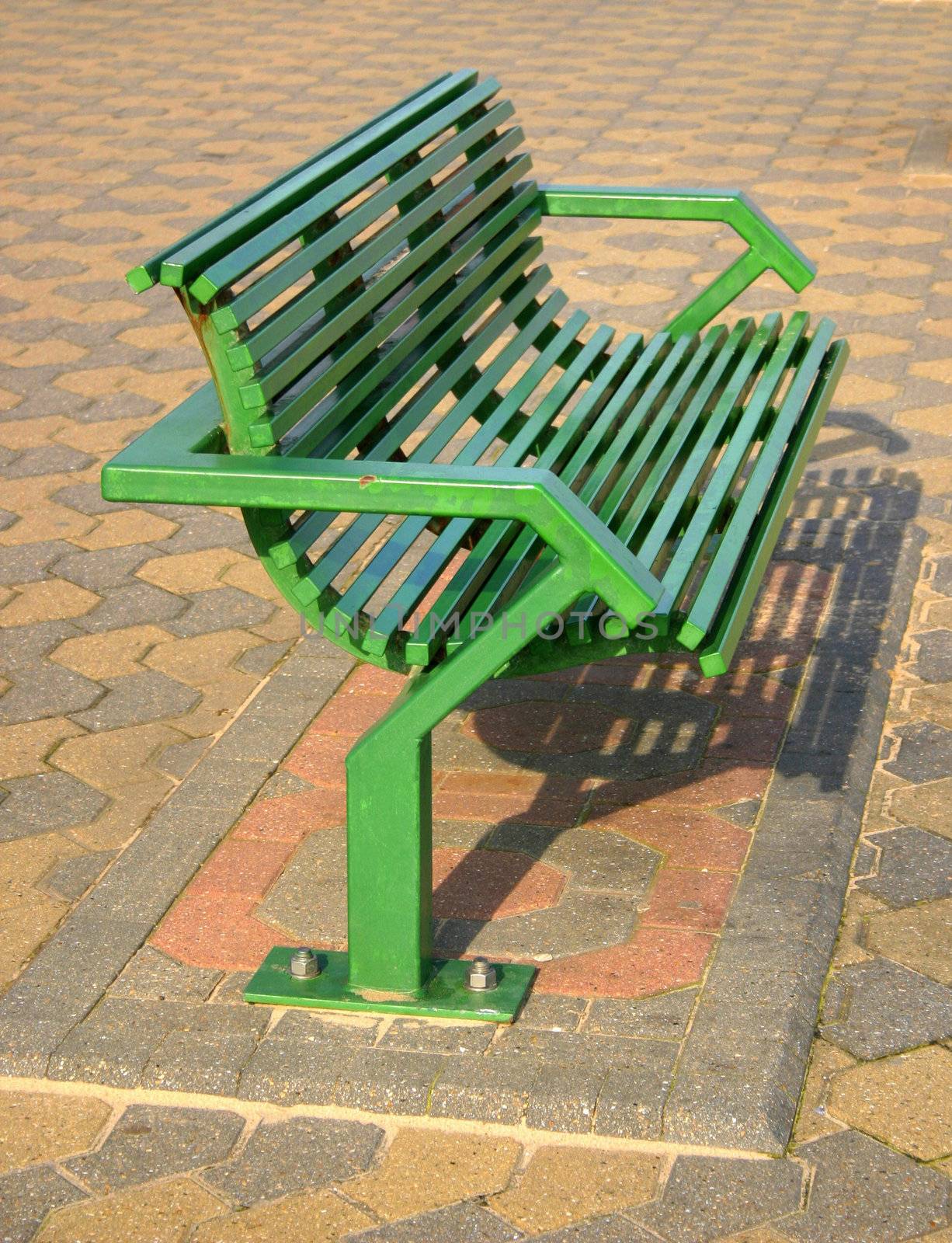 green bench by leafy