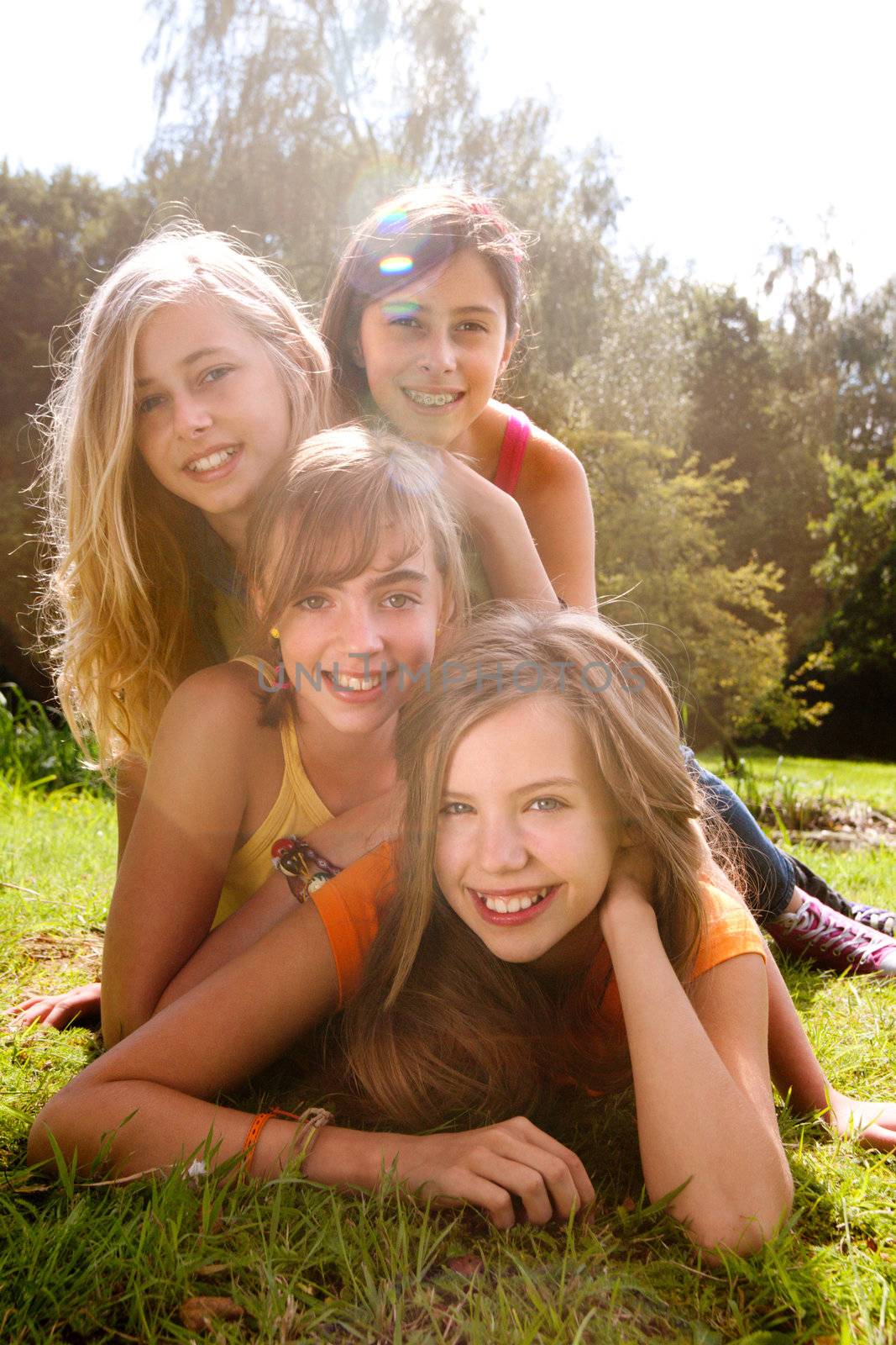 4 happy girlfriends are having a good sunny day