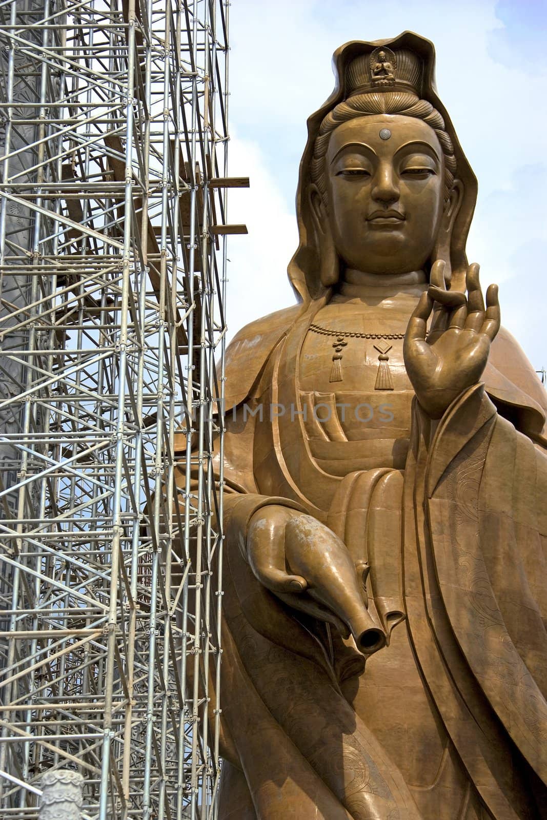 Image of a massive Chinese Goddess of Mercy Statue under construction in Malaysia.