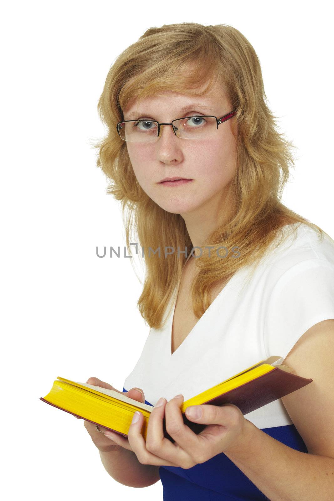 The woman wearing spectacles reads the book