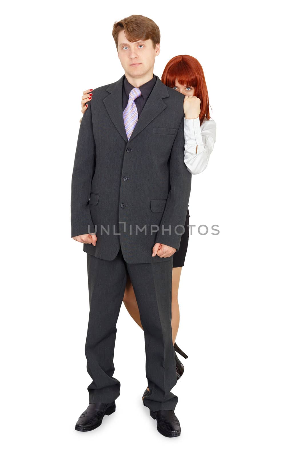 Woman hiding behind a man isolated on white background