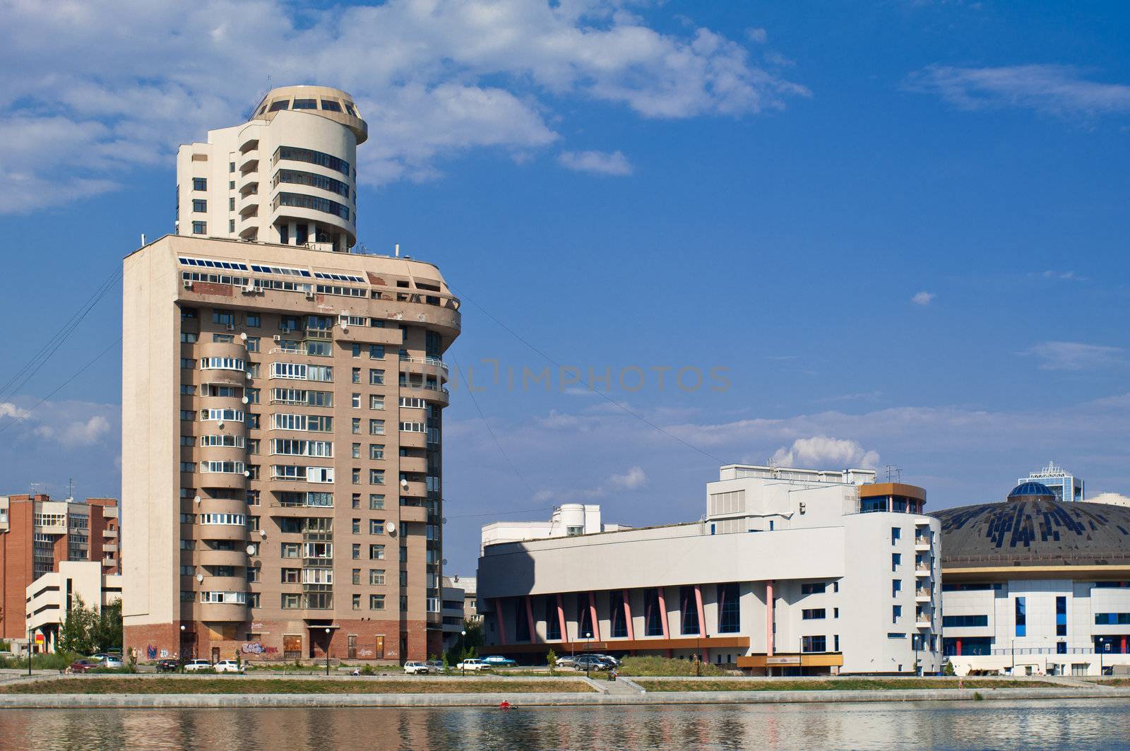 Modern city view with the river in front shot in bright sunlight