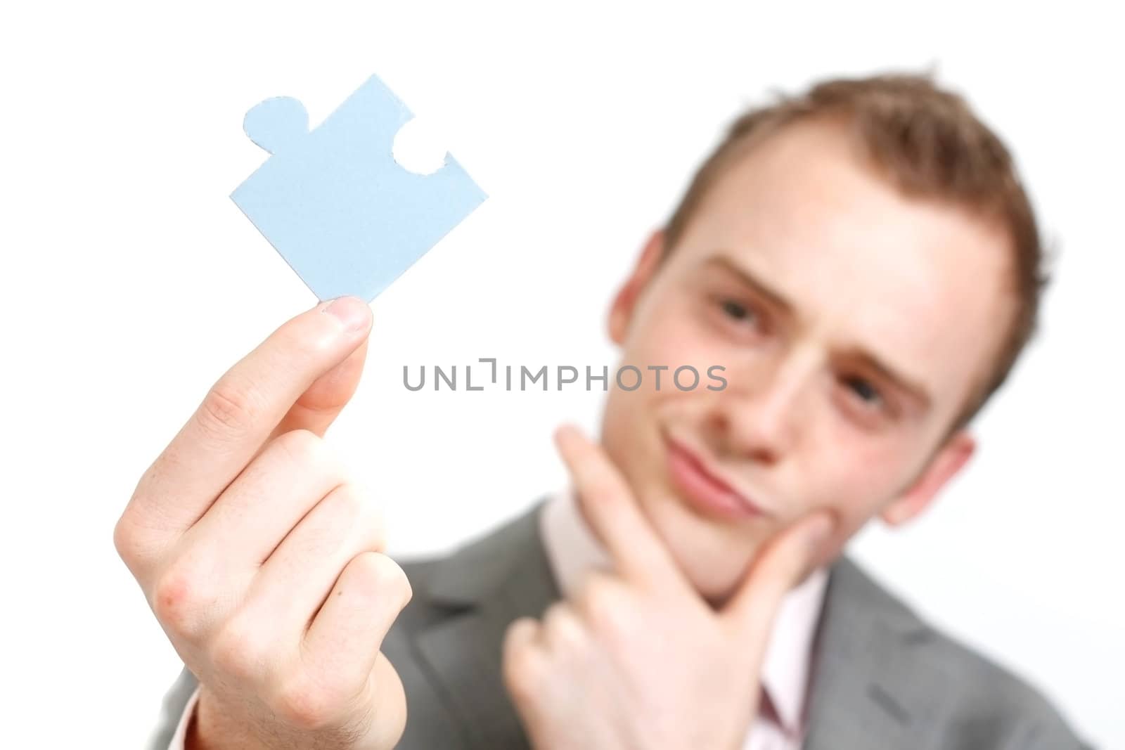 A business man solving a puzzle