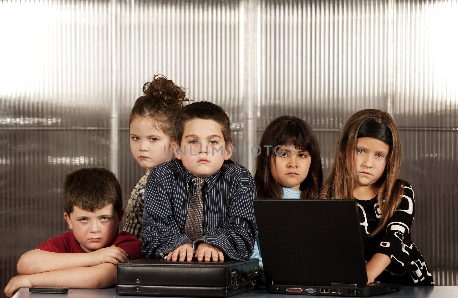 Kids posing as a professional business team