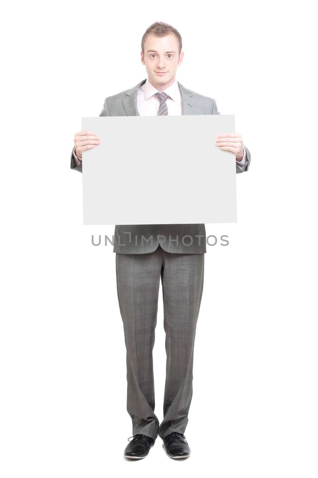 A business man holding an empty sign