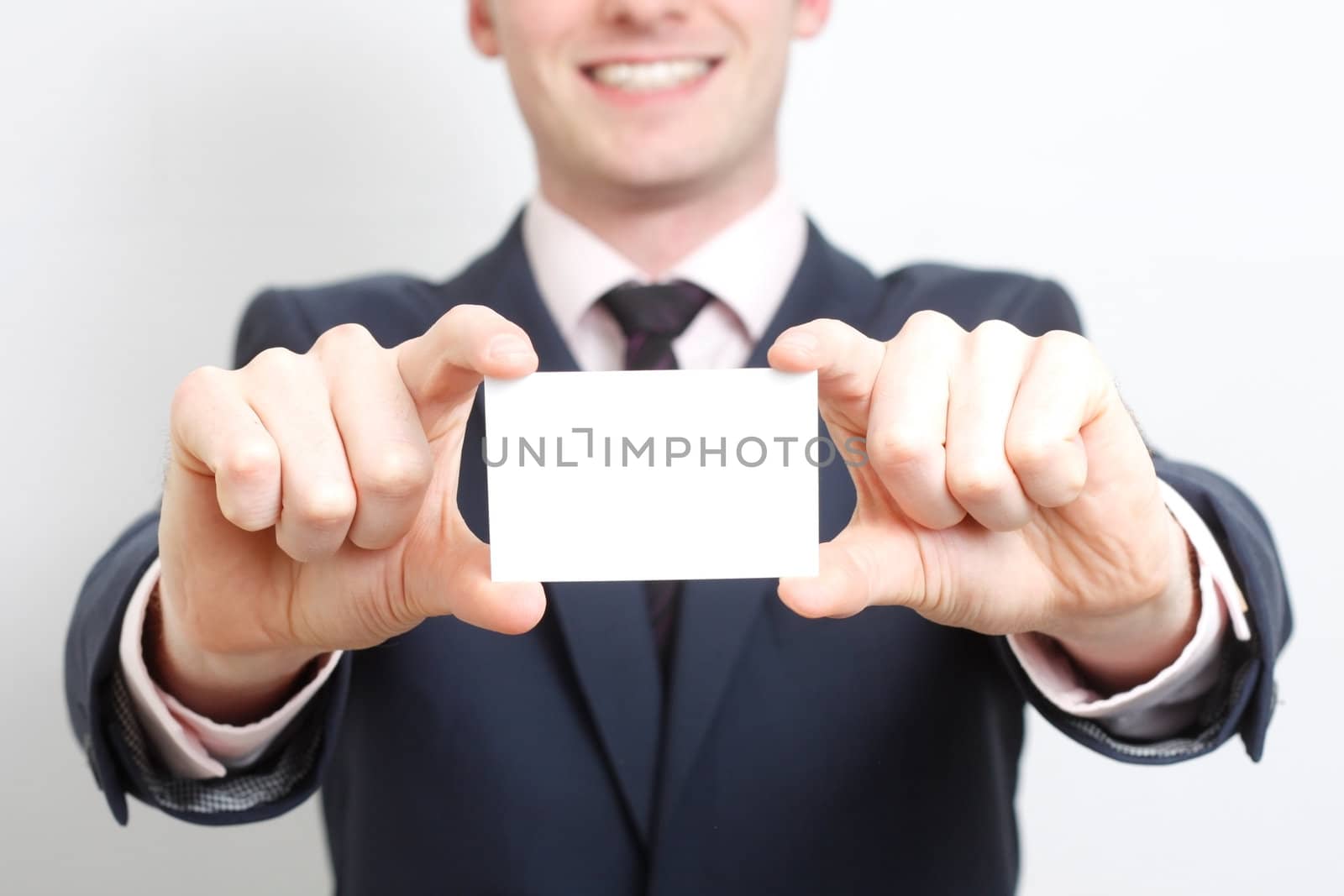 A business man presenting his business card