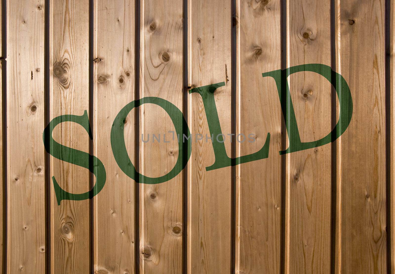 Sold. On a wooden wall background. Closeup, front view.