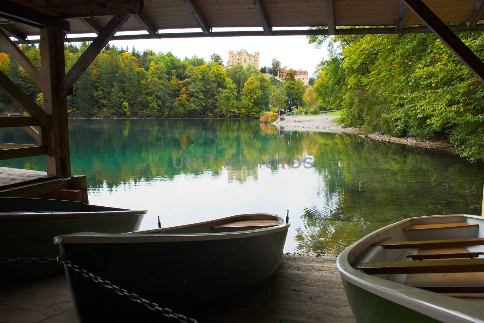 Boats moored on the lake near castle