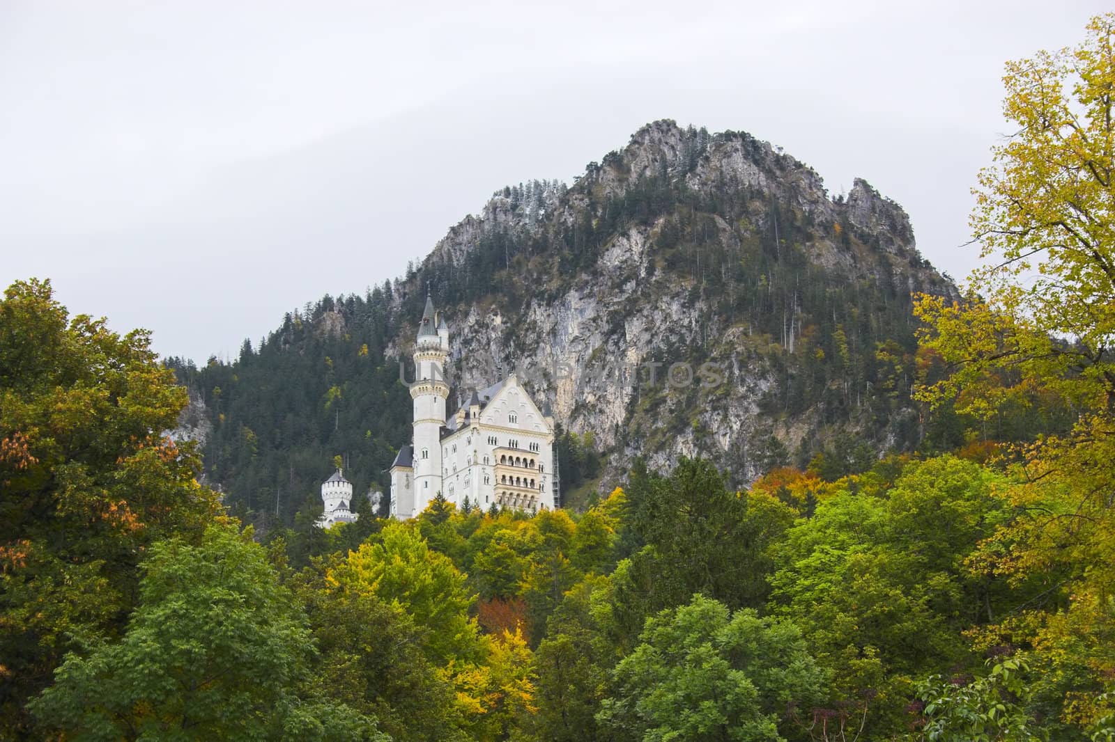 White Neuschwanstein castle in beautiful mountain setting