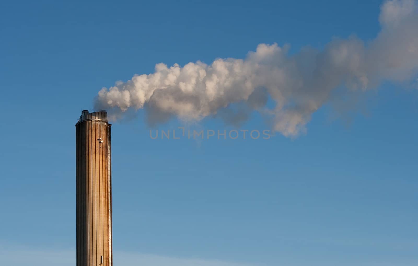 industrial smokestack on sky background