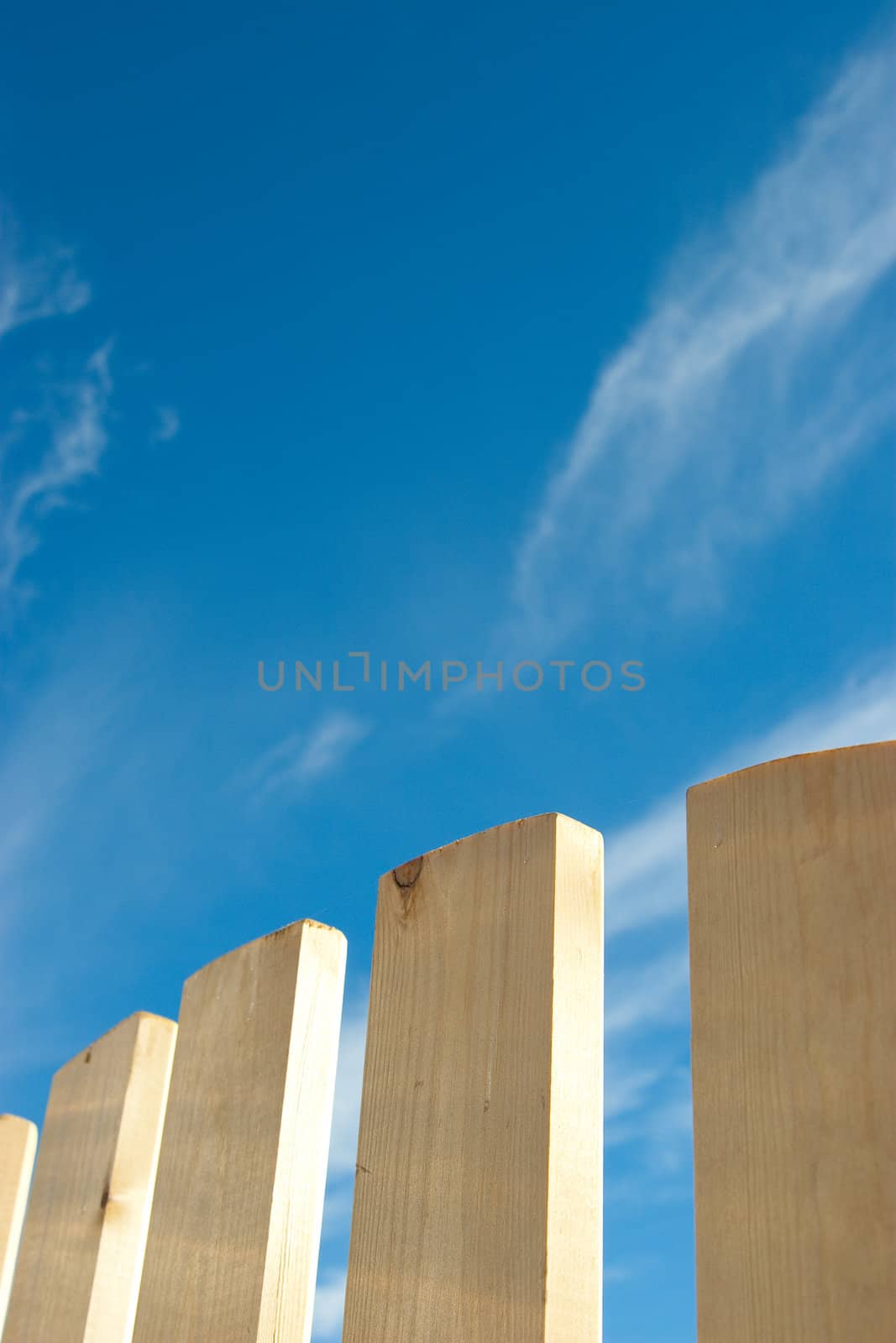 wooden fence on clear sky background
