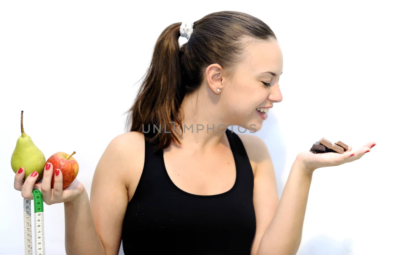 Girl holding an apple and chocolate