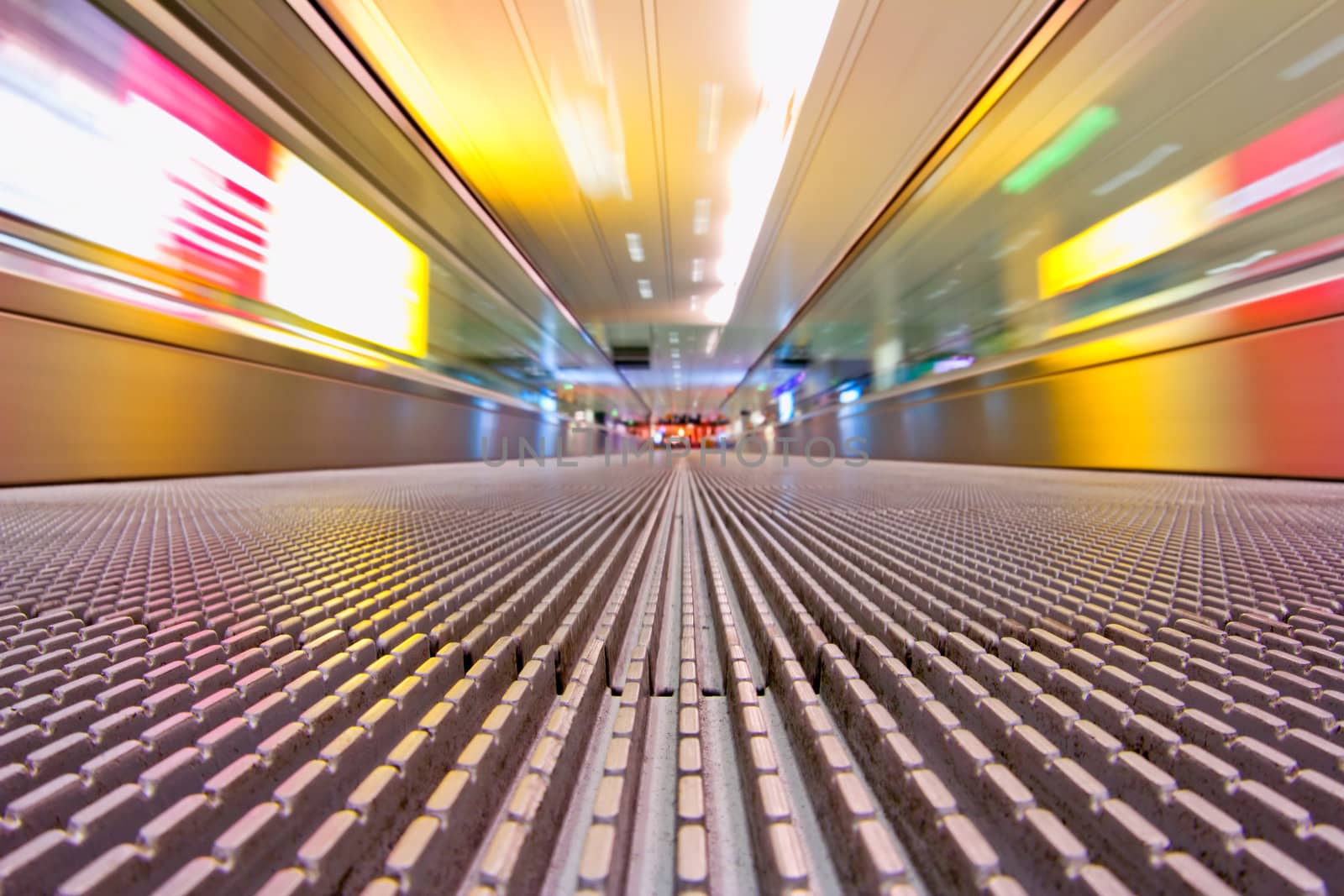 Photograph taken with a long shutter while traveling down an airport escalator