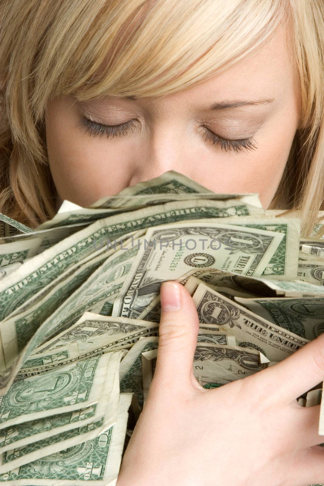 Beautiful blond woman holding money