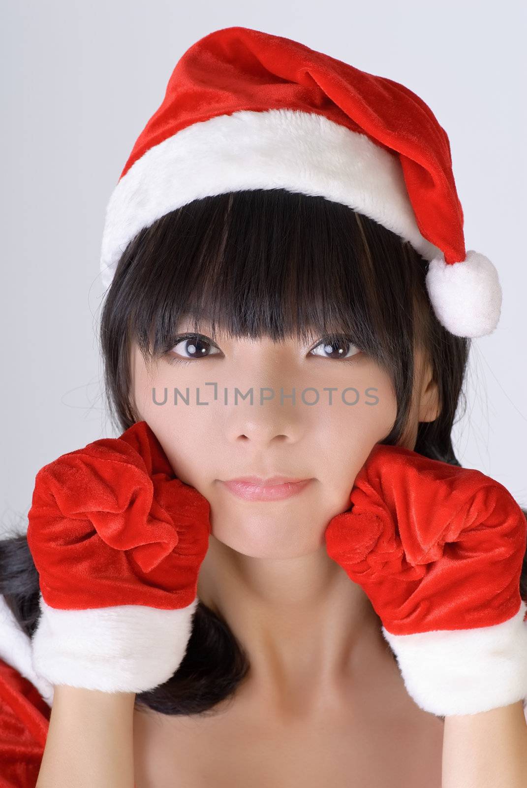 Sweet Christmas girl of Asian, closeup portrait.