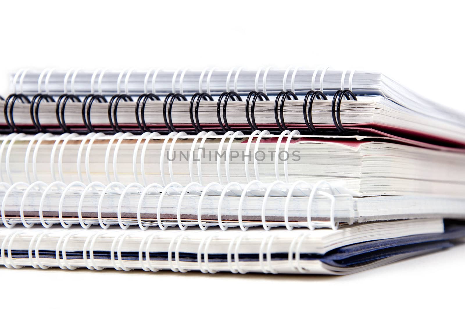 Stack of copybooks isolated on white background