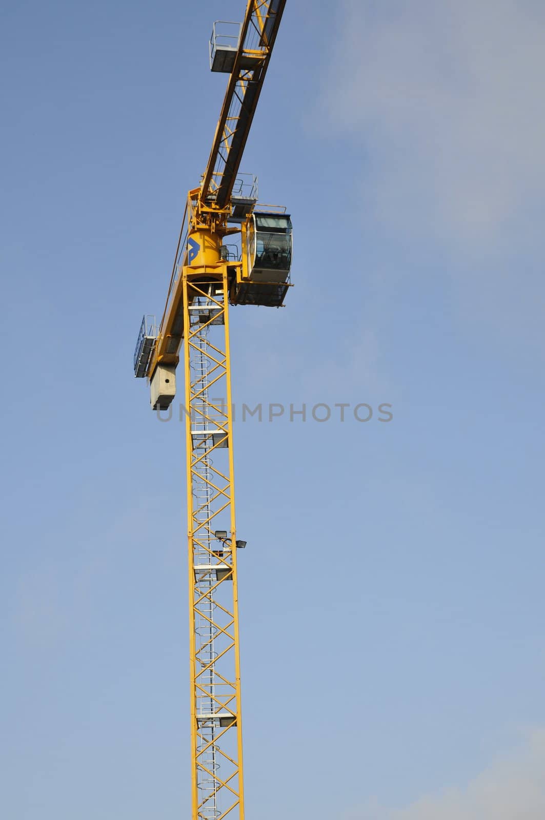 Yellow crane on a blue sky